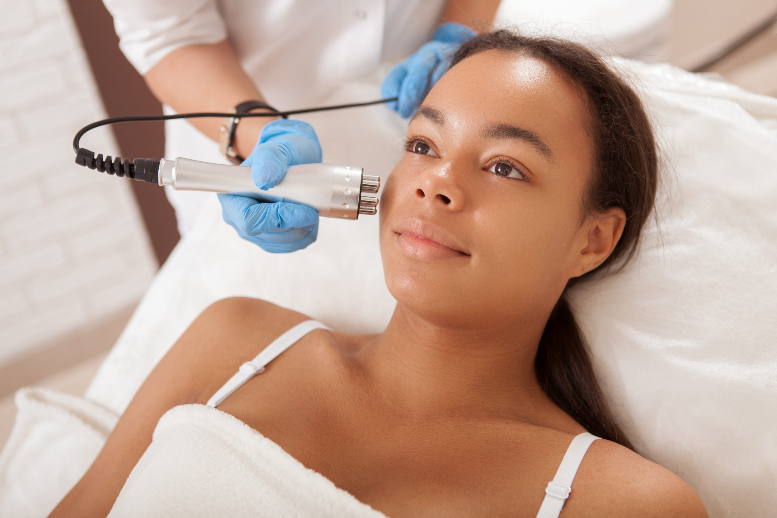 Emsculpt Neo Skin Tightening | Young African woman getting facial treatment